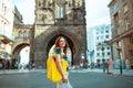 Woman hiker in front of Powder Tower in Prague having excursion Royalty Free Stock Photo