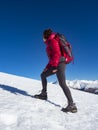 Woman hiker on a glacier with crampons on boots