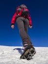 Woman hiker on a glacier with crampons on boots Royalty Free Stock Photo