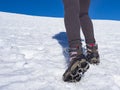Woman hiker on a glacier with crampons on boots Royalty Free Stock Photo