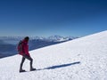 Woman hiker on a glacier with crampons on boots Royalty Free Stock Photo