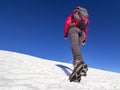 Woman hiker on a glacier with crampons on boots Royalty Free Stock Photo