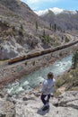 A woman hiker looks out over the Truckee River.