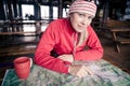 Woman hiker with map planning trip
