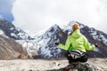 Woman Hiker Meditating on Rocks in Himalaya Mountains, Nepal Royalty Free Stock Photo