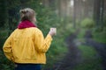 Woman hiker meets cold morning with a cup of hot coffee