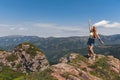 Happy Woman with Hands Up on Mountain Top Royalty Free Stock Photo