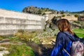 Woman hiker at the Ponton de la Oliva dam, the oldest dam in Madrid, Spain