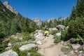 Woman hiker poses along the Cascade Canyon hiking trail in Grand Teton National Park Wyoming Royalty Free Stock Photo