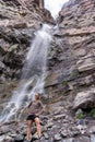 Woman hiker poses at Cascade Falls waterfall in Ouray Colorado Royalty Free Stock Photo