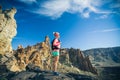 Woman hiker reached mountain top, backpacker adventure Royalty Free Stock Photo