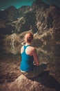 Woman hiker resting near lake