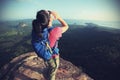 Woman hiker shouting hiking on mountain peak Royalty Free Stock Photo