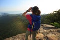 Woman hiker shouting hiking on mountain peak Royalty Free Stock Photo