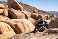 Woman Hiker Sits and Smiles At The Camera Royalty Free Stock Photo