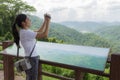 Woman hiker taking photo with camera at mountain Royalty Free Stock Photo