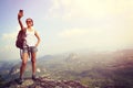 Woman hiker taking photo with cellphone