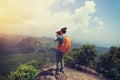 Woman hiker taking photo hiking on mountain peak Royalty Free Stock Photo