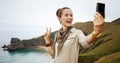 Woman hiker taking selfie with digital camera Royalty Free Stock Photo