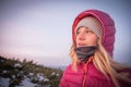 Woman hiker on a top of a mountains. First sun lights rise. Hiker relaxing in the mountain and enjoying sun. Backpack freedom conc Royalty Free Stock Photo