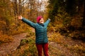 The woman hiker travels in the woods is looking around Royalty Free Stock Photo