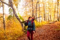 The woman hiker travels in the woods is looking around Royalty Free Stock Photo