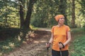 Woman hiker trekking and walking in forest Royalty Free Stock Photo