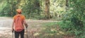 Woman hiker trekking and walking in forest Royalty Free Stock Photo