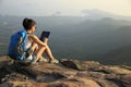 Woman hiker use digital tablet at mountain peak Royalty Free Stock Photo