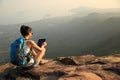 Woman hiker use digital tablet at mountain Royalty Free Stock Photo