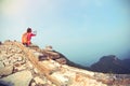 Woman hiker use digital tablet sit on chinese great wall