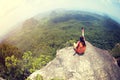 Woman hiker use smartphone taking photo on seaside mountain top Royalty Free Stock Photo