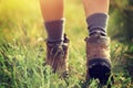 Woman hiker walking on trail in grassland Royalty Free Stock Photo