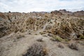 Woman hiker walks along a dirt trail through the Alabama Hills to the The Mobius Arch Loop Trailhead Royalty Free Stock Photo