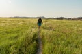 Woman Hikes Through Badlands