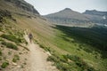 Woman Hikes Up Trail to Piegan Pass