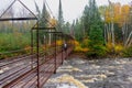 Woman hiking across suspension bridge over river Royalty Free Stock Photo