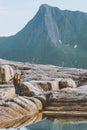 Woman hiking alone enjoying view outdoor in mountains travel solo