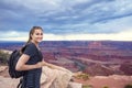 Woman hiking along a beautiful scenic canyon overlook