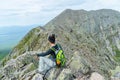 Woman hiking along Knife Edge Trail of Mount Katahdin Northeast Piscataquis Maine USA