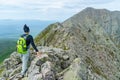 Woman hiking along Knife Edge Trail of Mount Katahdin Northeast Piscataquis Maine USA