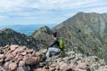 Woman hiking along Knife Edge Trail of Mount Katahdin Northeast Piscataquis Maine USA