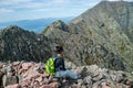 Woman hiking along Knife Edge Trail of Mount Katahdin Northeast Piscataquis Maine USA