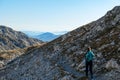 Hochschwab - A woman hiking with a mountain goat