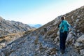 Hochschwab - A woman hiking with a mountain goat