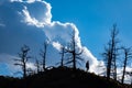 Woman hiking along a mountain ridgeline in Colorado