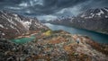 Woman hiking along turquoise and blue lakes in mountain landscape on hike of Knutshoe in Jotunheimen National Park in Norway