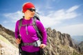 Woman hiking with backpack in inspirational mountains