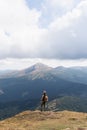 Woman hiking with backpack and trekking poles. Nature tourism in Ukrainian Carpathian mountains Royalty Free Stock Photo