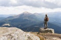 Woman hiking with backpack and trekking poles. Nature tourism in Ukrainian Carpathian mountains Royalty Free Stock Photo